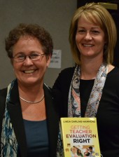 Linda Darling-Hammond (L), and Shanan Brown, with a copy of Darling-Hammond's book on teacher evaluation.
